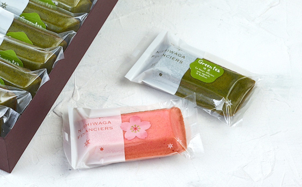 新緑の山に桜が咲いている西和賀の春の風景をイメージして箱詰めされたフィナンシェには、店主の想いが込められています